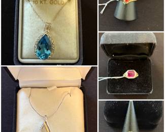 Collection of 10K gold jewelry pieces, including necklace, and a blue topaz pendant and ring sets.