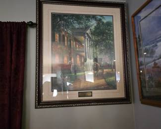

The artwork pictured appears to be a framed print titled "The Guests Arrive" by artist Leslee Turnbull, depicting a scene reminiscent of the Haunted Mansion attraction. 