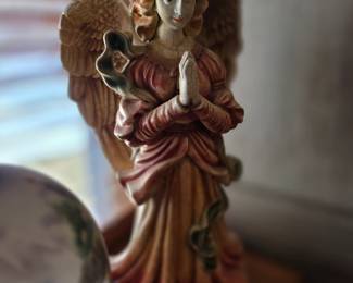 This vintage angel figurine features detailed wings and a pink robe, similar to styles produced by brands like Fontanini for nativity sets. 