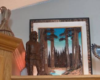 vintage-style framed painting of a forest landscape featuring redwood or sequoia trees, displayed alongside a hand-carved wooden sculpture of a person. 
Item Type: Original art collectible