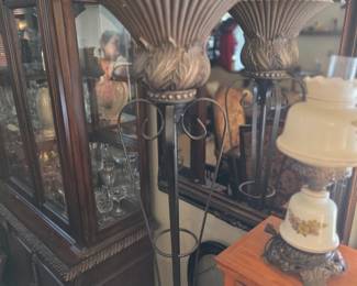  Art Deco floor lamp features a wrought iron base and a decorative bowl-shaped shade, likely intended for upward illumination. 