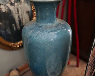 vintage art pottery vase, likely from the Gonder company, featuring a distinctive powder blue flambé glaze. 