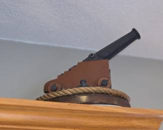 vintage or decorative signal cannon, often used for signaling or saluting in nautical contexts. 
