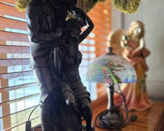 vintage French Art Nouveau style figural lamp, often cast in spelter or bronze, depicting a man and a maiden, a popular design attributed to artists like Auguste Moreau. 