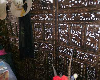 
This item is an antique hand-carved (appears to be) teak wood room divider screen. 