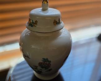 vintage Japanese porcelain ginger jar, likely featuring floral designs and gold trim. 