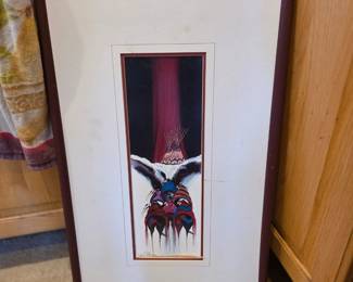 This framed artwork appears to be a vintage Native American painting, possibly a print or original work, featuring spiritual or ceremonial themes similar to styles found in Plains Indian art. 