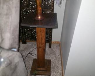 Arts and Crafts style wooden pedestal plant stand, likely crafted from dark-stained oak and featuring a tapered column design. 