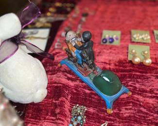 This item is a vintage cast iron mechanical piggy bank depicting a dentist pulling a patient's tooth. 
Item Type: Mechanical toy bank, often referred to as the "Dentist" bank. 