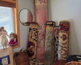 decorative area rugs, possibly traditional Persian or Oriental style carpets. 
They feature intricate floral and geometric patterns typical of handmade or high-quality machine-made rugs. 
Materials typically include wool, silk, or cotton. 
Such rugs vary significantly in value based on age, knot density, and craftsmanship. 