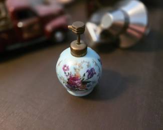 
This item is a vintage porcelain perfume bottle atomizer, likely produced in Japan or Germany