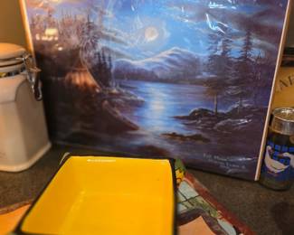 
The main subject of this image is a framed art print titled "Full Moon" by artist Sharon Evans, featuring a serene night scene of a lake and a campsite. 