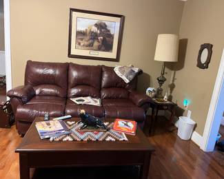 Leather Recliner Couch , Solid Wood Coffee Table, Native American Tapestry, Ceramic Bull, Native American Coffee Table Books