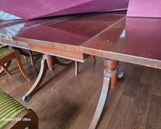 Duncan Phyfe table with leaves and chairs