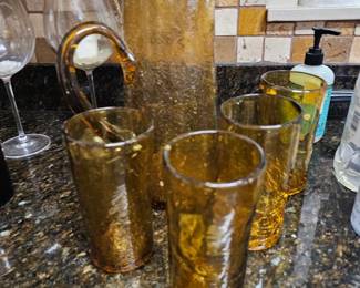 Amber glass pitcher and mugs