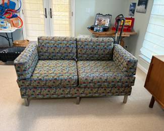 $320. Custom upholstered loveseat. 62 inches wide by 30 inches deep by 32 1/2 inches high. Metal legs and frame.