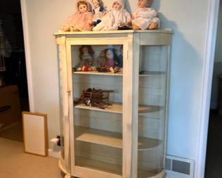 $140. Wood and glass display cabinet. Four shelves including the bottom. Interior dimensions equals 12 1/2 inch deep shelves exterior. It is 46.5 inches wide by 18 inches deep by 60 inches high.