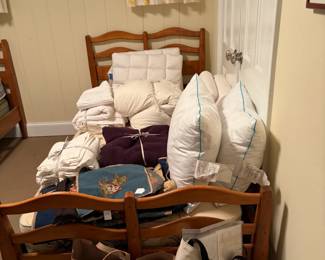 The second bed with bedding and pillows for sale during in-person shopping Friday and Saturday.