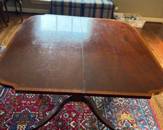 View of the game table fully opened showing the inlay detail around the edge of the top.