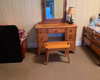 $240. Vintage maple from the 40s bedroom set includes this vanity with mirror and matching stool and a pair of twin beds in the following photos. Vanity is 18 1/2 inches deep by 40 inches wide by 60 inches high. Without the mirror, it is 29 inches high.