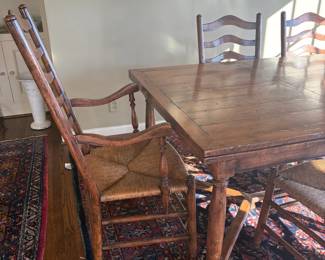 Another view of the table with less sun shining on it.  A  plank style top. 