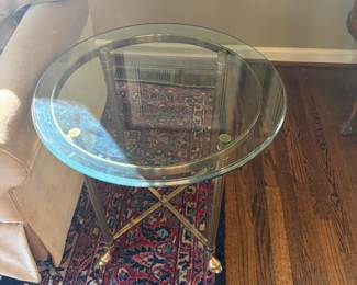 $380. La Barge vintage 1960's round glass on brass base occasional table. It is 24 inches in diameter by 24 inches high.  Hooved feet.