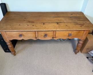 $320. Antique pine three drawer library table. 64 1/2 inches wide by 26 inches deep by 29 1/2 inches high.