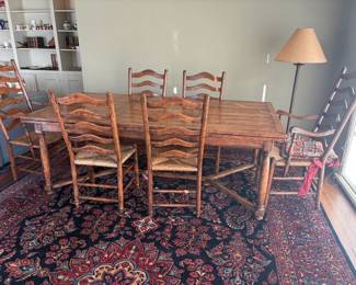 $3800. Beautiful Refectory plank top dining table and six chair chairs with  rush  seats.  Table is Guy Chaddock. Chairs are vintage. Table is 84 inches long by 44 inches wide by 30.5 inches high as seen. Also has two self storing extensions to lengthen the table by 21 inches at each end for a total of 126 inches long.