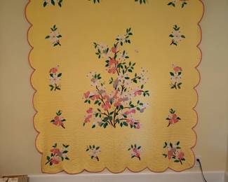 Antique floral appliqué with sewn on rod pocket for hanging on a wall if you choose to do so.  More quilts also in the sale.