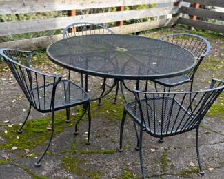 $300. Wrought  iron round table with four chairs. Table is 48 inches in diameter by 29 inches high.
