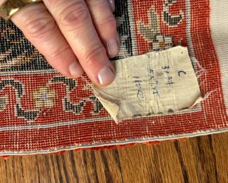 Photo of the label on the back of the Antique rug.