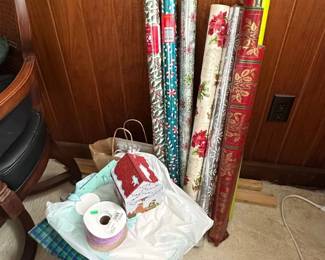 Collection of Holiday Wrapping Paper Rolls and Ribbon