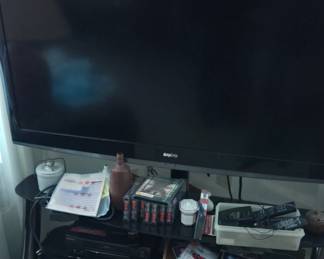 Tv with things to sell underneath