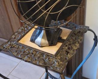 Vintage deco fan and brass and marble plant stand