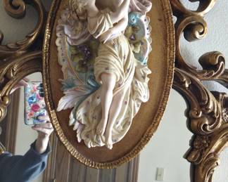 On top of the hall mirror