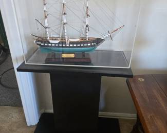 USS Constitution ship in case, black stand