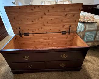 Cedar lined blanket trunk with seat pad. Perfect for the end of the bed.