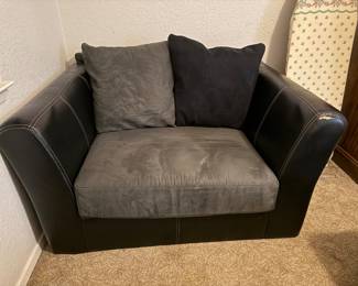 Clean and comfy. Small tear on one arm still has a lot of use left in it. Great for game room or man cave.