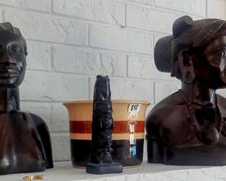 jr carved busts on mantle