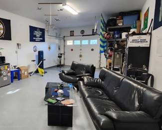 Leather Dania couch and chair, coffee table, exercise bike, small refrigerator