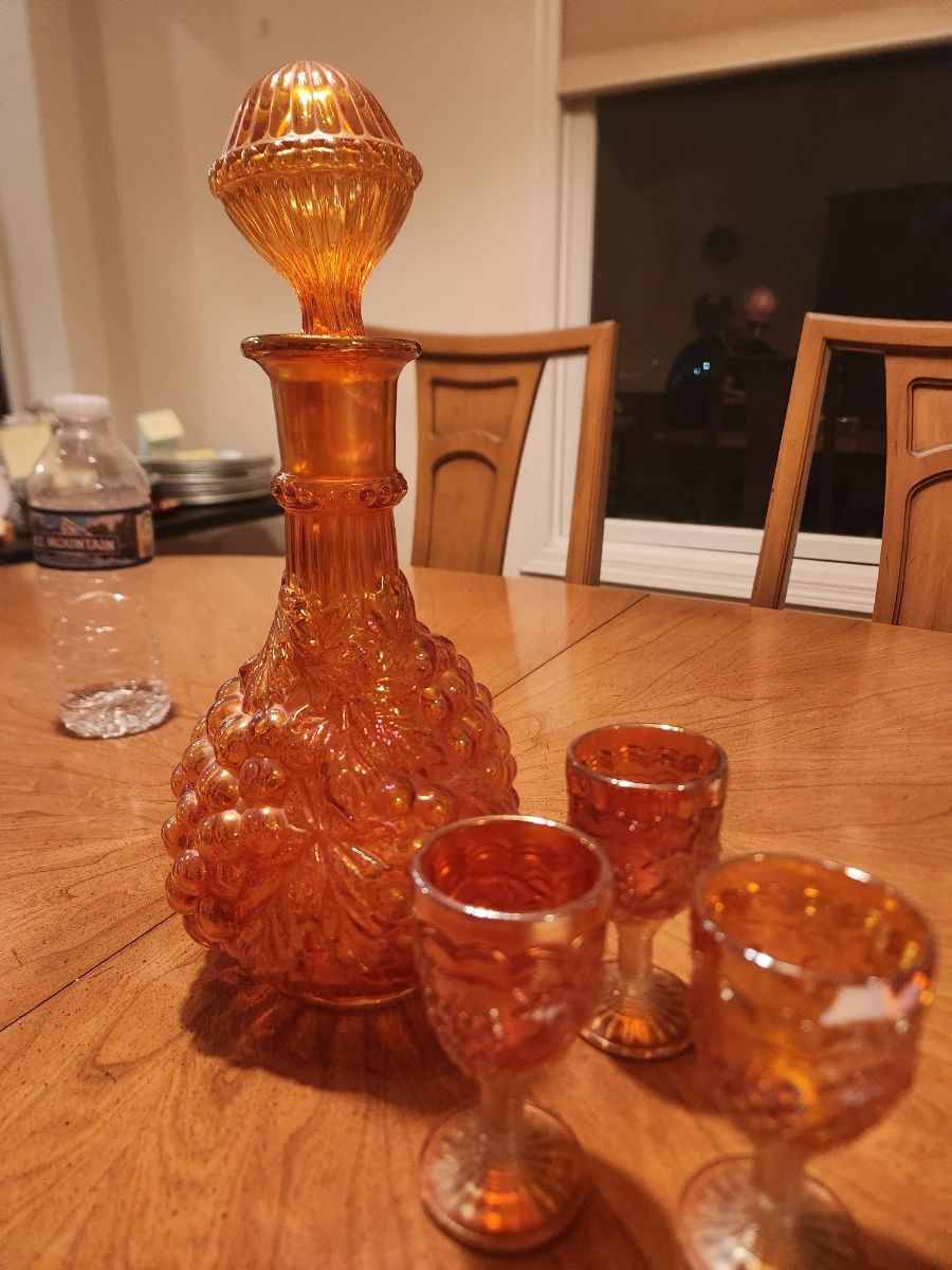 Vintage Carnival Glass decanter and 3 cordial glasses; $15