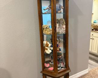 Cabinet and vintage dolls