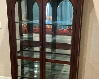 Beveled glass and tooled wood cabinet