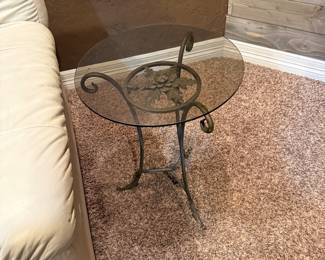 Two small black iron and glass table