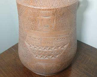 Very nice fired clay jar with incised detailing. No other discernible markings. 10x13. $60.