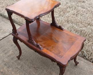 These beautiful vintage (circa 1940) end tables have complimentary (but not identical) workmanship to the settee. Just look at the carvings on the legs, and that top with book matched veneer and Rosewood inlay! 16x25, tops at 17/27. $180 for the pair.