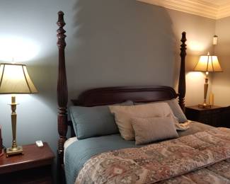 King-size four-poster bed frame with complimentary mattress. 