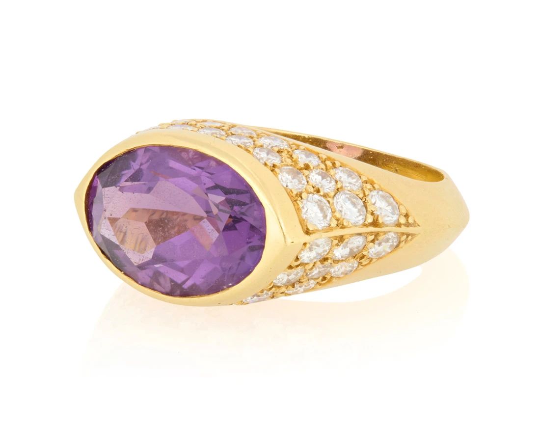 1 Van Cleef & Arpels: An 18K Gold, Amethyst and Diamond Ring Centering an oval amethyst weighing approximately 5.25 carats, accented by round diamonds weighing approximately 2.30 carats, signed VCA, 5H224-1  Size: 6 1/4 10.6 grams gross Estimate: $3,500 - $5,500