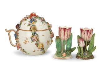 249 Three creamware articles 19th century The cup with pseudo puce-painted crossed swords Comprising a floral encrusted covered cup and pair of tulip ornaments 3 pieces Cup: 5.625" H x 6.5" W x 5.75" D; Taller tulip: 4" H x 2.875" W x 2.375" D Estimate: $300 - $500