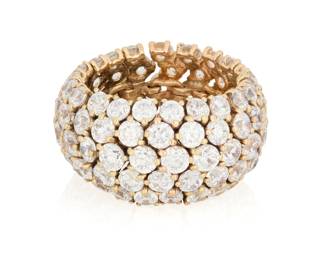 43 A 14K Gold and Diamond Eternity Band Featuring five graduated rows of round diamonds weighing approximately 13.20 carats in a flexible design  Size: 8 1/2 15.2 grams gross Estimate: $4,000 - $6,000